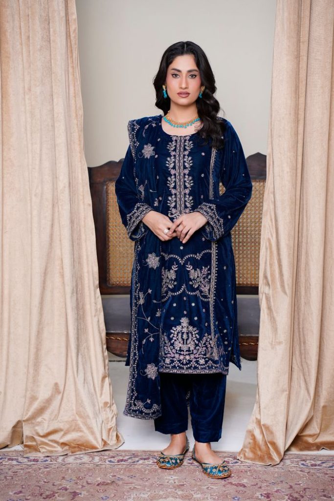 Model wearing traditional embroidered dress in Lahore, Pakistan.